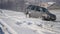 21.01.2018, Chernivtsi, Ukraine - Winter driving. Car drives by icy track on snow covered lake at winter. Sport car