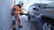 21.01.2018, Chernivtsi, Ukraine - worker wash car strong streams of water winter