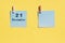 21 December. 21th day of the month, calendar date. Two blue sheets for writing on a yellow background. Top view, copy space.