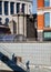 22 Jan 2023 - London UK: Shadow of people walking down steps on tiled wall on sunny day in city