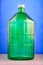 A 22 liter glass jar is made of thick green glass, image on a blue background