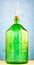 A 22 liter glass jar is made of thick green glass, with a water lockimage on a blue background