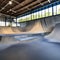 221 A contemporary urban skate park with sleek ramps, vibrant street art, and a vibrant atmosphere, attracting skateboarders and