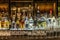 24.02.2019 Peking China - Wall with Bitters and alcohols whiskey bar counter bottles ambient tlight blurred background