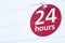 24 hours sign round red circle on white background for shop opening times