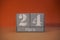 24 Marz on wooden grey cubes. Calendar cube date 24 March. Concept of date. Copy space for text. Educational cubes