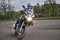 25-05-2020 Riga, Latvia. Motorcyclist goes on road, front view, closeup