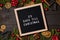 25 Days till Christmas countdown letter board on dark rustic wood