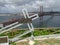 25 de Abril bridge under the Tagus river seen in perspective from Almada Lisbon with crucifix in the foreground