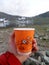 25 july 2017, Russia, Komi, Ural mountains. A paper cup with the logo of the international network of pizzerias Dodo pizza man