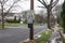 A 25 mile per hour speed limit sign on a wooden utility pole on the side of a community street