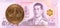 25 thai satang coin against 500 new thai baht banknote