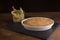 254/5000 Brazilian gratin served with vegetables in a glass jar, on a slate