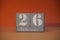 26 Februar on wooden grey cubes. Calendar cube date 26 February. Concept of date. Copy space for text. Educational cubes