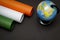 26th Jan Republic Day, Head-on shot of Indian Flag made up of chart papers with World map globe, copy space for text, tricolor,
