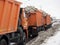 27.02.2021 Russia, Moscow. A convoy of trucks full of snow stands on the road on the way to the snow processing point. Cleaning