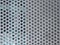 288 / 5.000Resultados de traducciÃ³nMetal panel background with holes. Perforated aluminum sheet metal. Full frame perforated