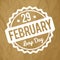 29 February Leap Day rubber stamp white on a crumpled paper brown background.