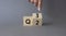 From 2nd Quarter to 3rd symbol. Businessman hand points at turned wooden cube with words 2nd Quarter and 3rd Quarter. Beautiful