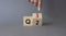 From 2nd Quarter to 3rd symbol. Businessman hand points at turned wooden cube with words 2nd Quarter and 3rd Quarter. Beautiful