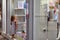 A 3-4 year old girl looks at a shop window in Chania