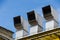 3 Air Ducts in a row on a building rooftop