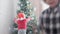 3 authentic happy Joy children wave hands hello rejoice by Christmas tree play have fun together. Preschool toddler kids