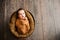 3. Baby girl in a brown wrap is yawning at a newborn photoshoot