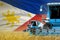 3 blue modern combine harvesters with Philippines flag on farm field - close view, farming concept - industrial 3D illustration