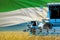 3 blue modern combine harvesters with Sierra Leone flag on rye field - close view, farming concept - industrial 3D illustration