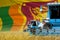 3 blue modern combine harvesters with Sri Lanka flag on grain field - close view, farming concept - industrial 3D illustration