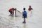 3 boys are fishing in Karnafuli River Sadarghat areas, Chittagong, Bangladesh.