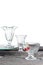 3 Clean glass bowls for ice cream, with cherries, with different texture, are on the table with a gray tablecloth