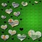 3-D money & black hearts on green glitter background