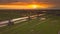 3 dutch windmills at sunset in netherlands