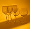 3 Empty wine glasses making shadow