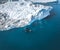 3 Humpback Whale dive near Ilulissat among icebergs. Their source is by the Jakobshavn glacier. The source of icebergs