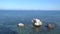3 lonely rocks in the sea are beautifully reflected in the water. Lovely place.