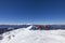 3 mountain climbers walk on snow in mountains