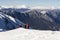 3 mountain climbers walk on snow in  mountains