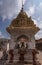 3 nandi statues behind fire at Virupaksha temple, Hampi, Karnataka, India