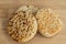 3 stacked pieces of toasted crumpets on brown wooden board.
