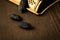 3 Tonka beans as spice with gold grater on dark brown wooden background