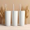 3 white 20 oz tumblers with straws and wheat stalk backdrop