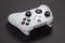 30 August, 2023 - Dnipro, Ukraine: White controller xbox Series S gamepad, game console on dark background