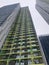 30 floors building gray green with windows line wall