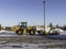 30 November 2019 - Calgary, Alberta Canada - Contruction equipment used to clear snow as a stripmall parking lot