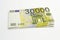 30000 euro bancnote on white background as concept for inflation, depreciation, economic crisis thematics