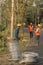 30th December, 2021, Baraipur, West Bengal, India: Two workers installing electric pole beside road and connecting with aluminum