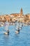 30th International Vila de PalamÃ³s Optimist Trophy, 14th Nations Cup. Sailboats sailing to the harbor small town Palamos in